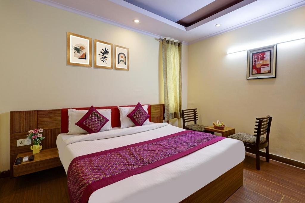 Ένα ή περισσότερα κρεβάτια σε δωμάτιο στο The Pearl- A Royal Residency