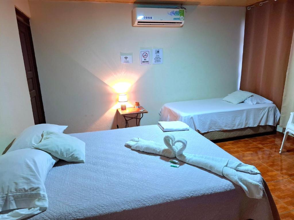 Postel nebo postele na pokoji v ubytování Hostel del Pacífico