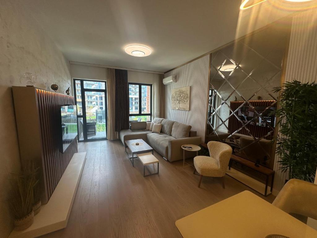 a living room with a couch and a table at Luxury Escape in Belgrade Waterfront in Belgrade