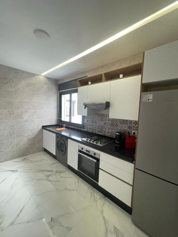 Kuchyň nebo kuchyňský kout v ubytování Oumaira Residence Azla-Tetouan