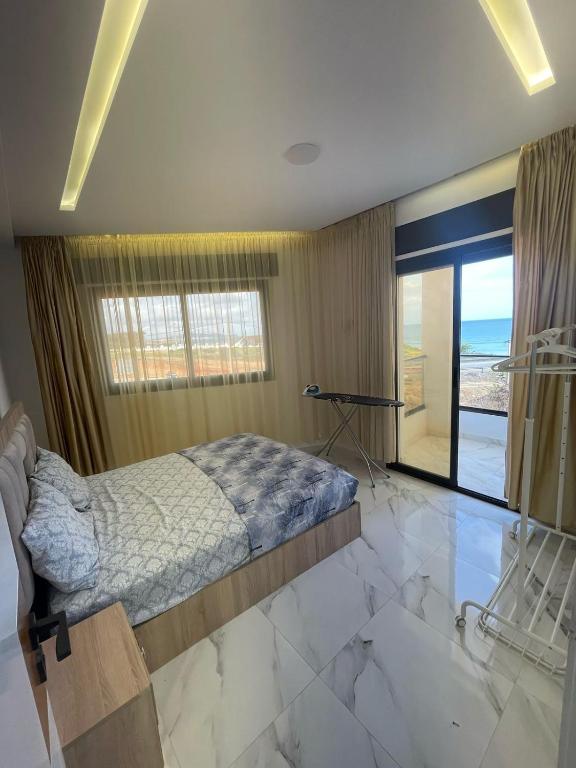 Postel nebo postele na pokoji v ubytování Oumaira Residence Azla-Tetouan