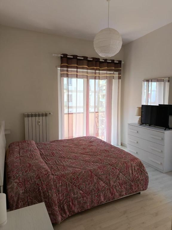 A bed or beds in a room at LA CASA DEI NONNI