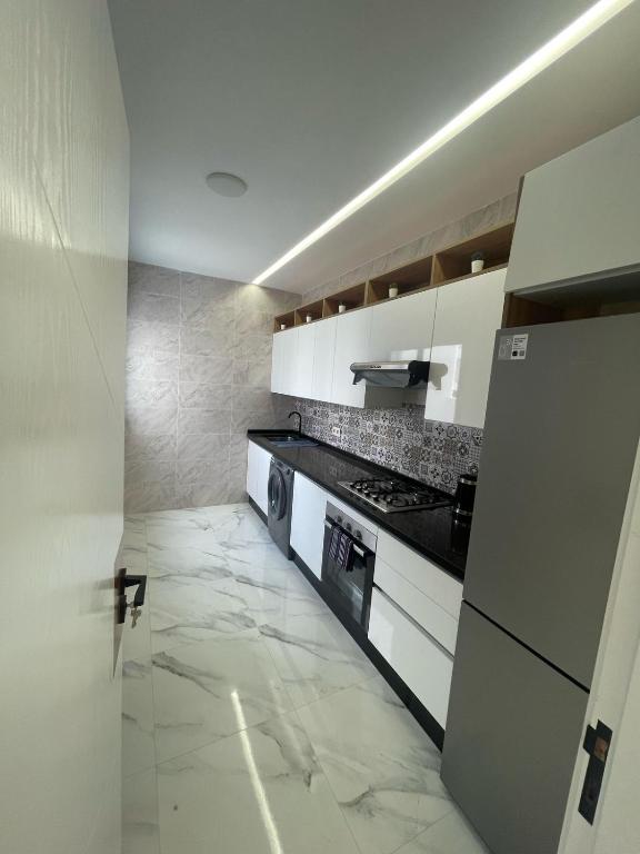 Kuchyň nebo kuchyňský kout v ubytování Oumaira Residence Azla-Tetouan