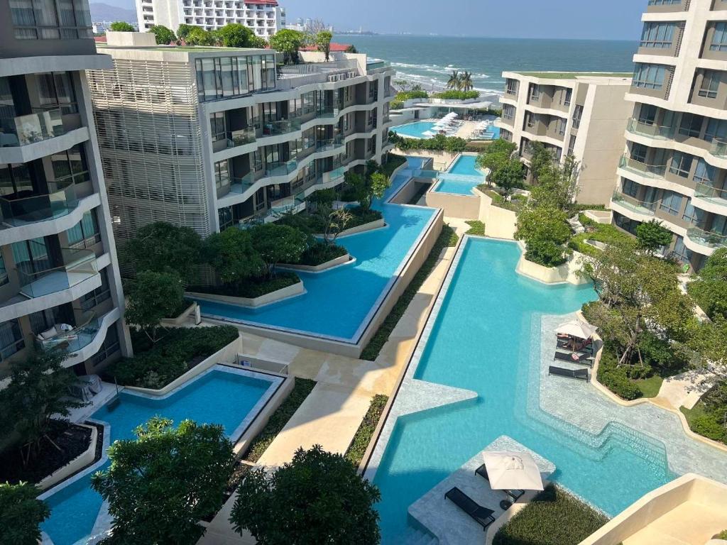 an aerial view of a resort with blue pools at Veranda by Welcome Hua Hin in Hua Hin