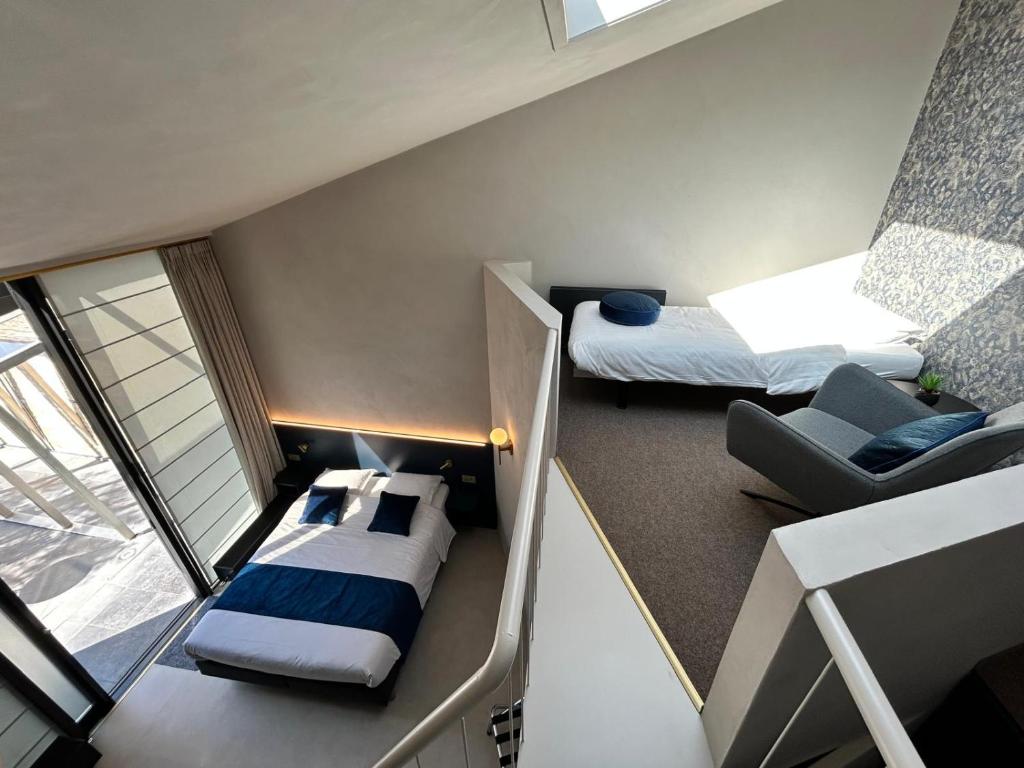 A bed or beds in a room at B&B Contrast