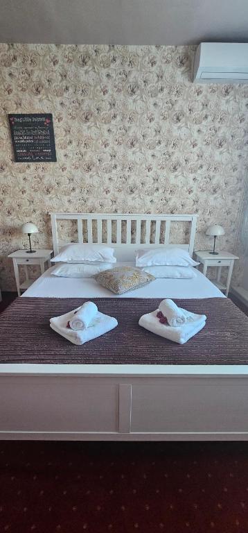 Postel nebo postele na pokoji v ubytování Hotel Olimp