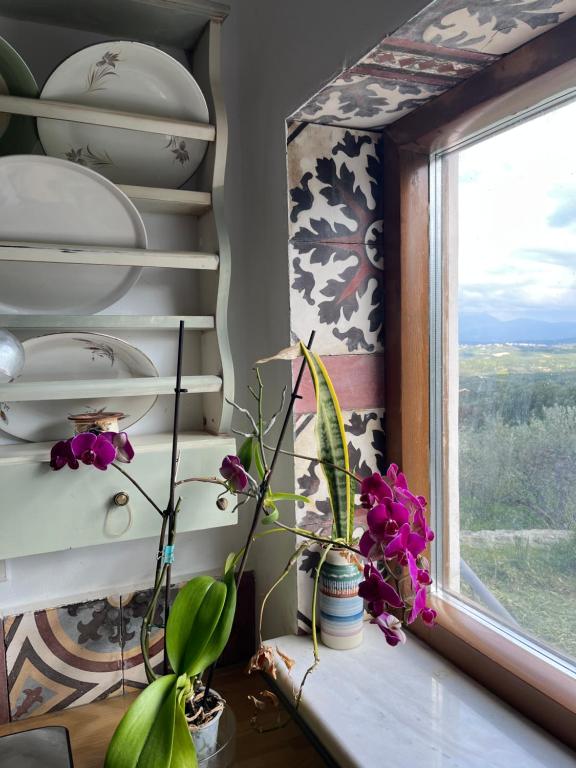 A bed or beds in a room at Aletraki -Off-Grid Retreat Above Heraklion, Peaceful Views