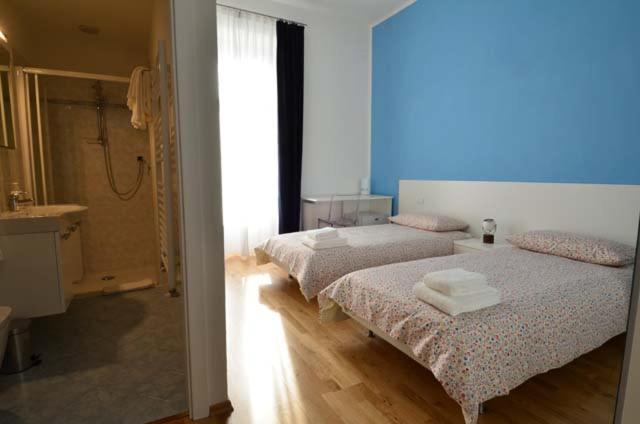 Postel nebo postele na pokoji v ubytování VILLA ARANCIO Ghiffa
