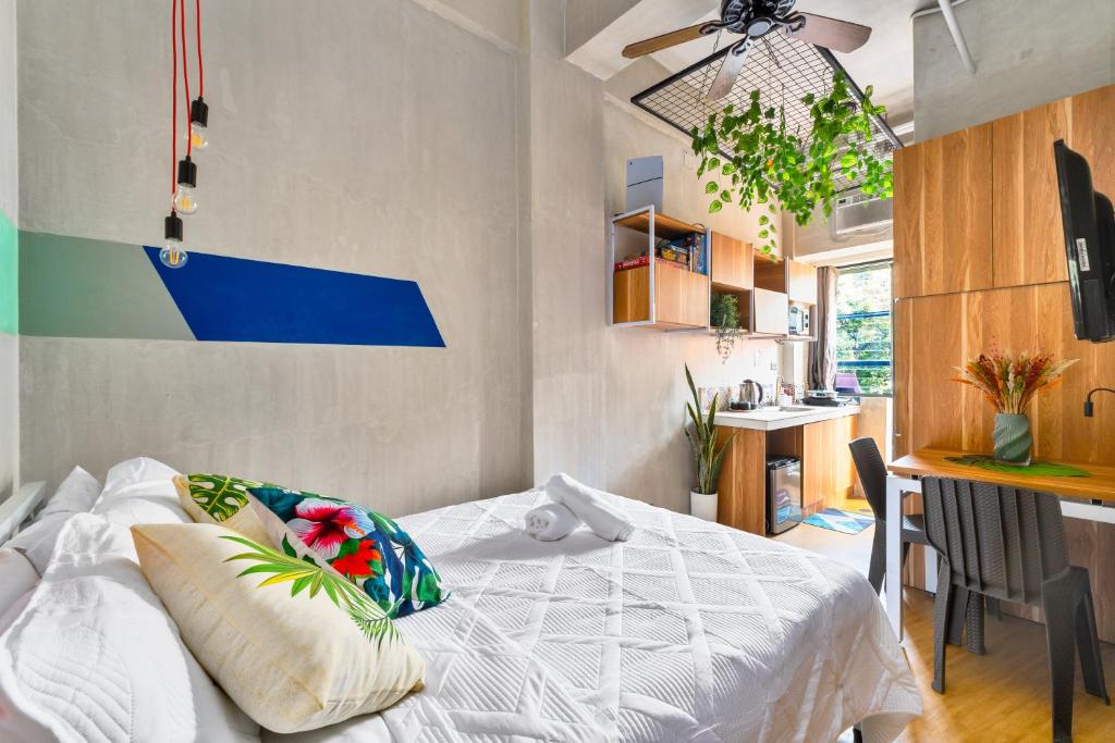 Postel nebo postele na pokoji v ubytování Redenza Suites