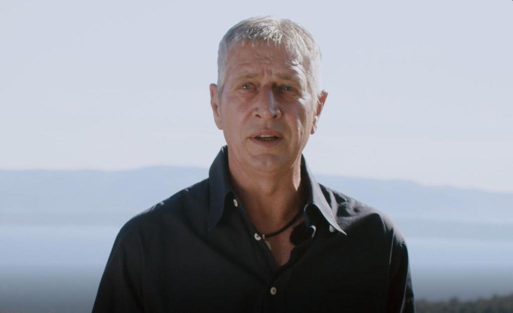 an older man wearing a black polo shirt at Apartman Dinko in Bol