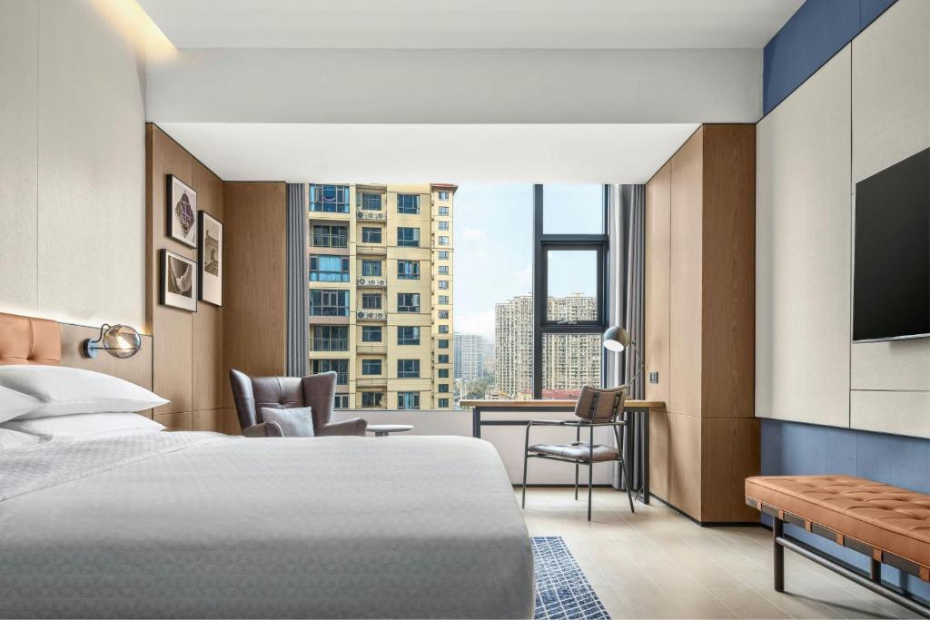 Postel nebo postele na pokoji v ubytování Four Points by Sheraton Hengyang Zhengxiang