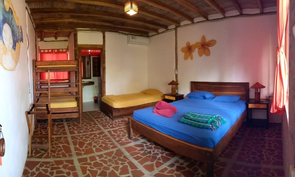 Postel nebo postele na pokoji v ubytování Suites La Tortuga
