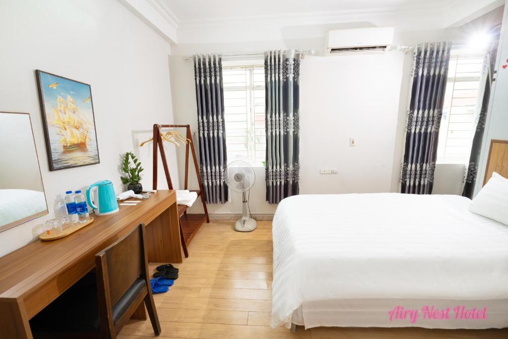 Postel nebo postele na pokoji v ubytování Airy Nest Hotel