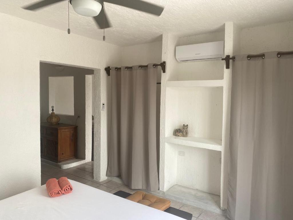 Postel nebo postele na pokoji v ubytování Caribo Cozumel