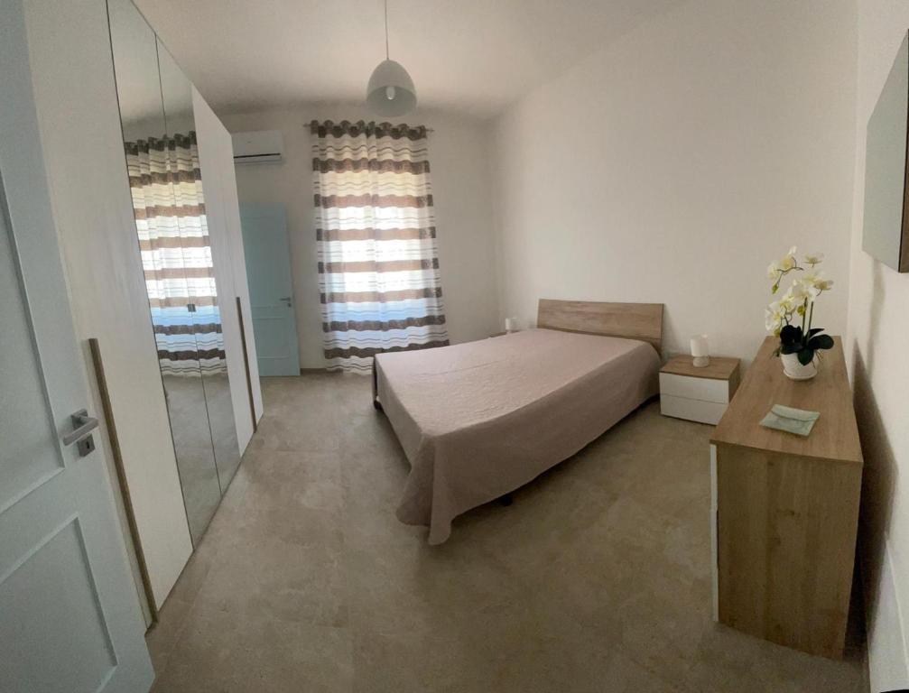 Postel nebo postele na pokoji v ubytování Casa vacanze Salento Sant Isidoro