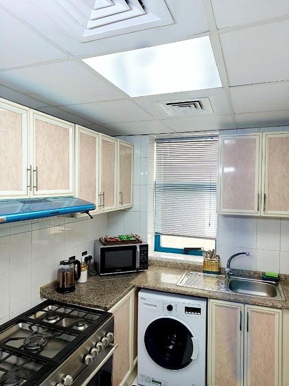 Kuchyň nebo kuchyňský kout v ubytování Ajman Family AIDEN Premium VIP