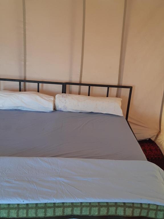 Letto o letti in una camera di Camp Les Bedouins iriki