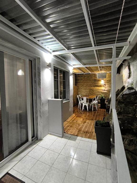 a living room with a table and a dining room at Cozy Houses One Apartment Hydromassage & Terrace in Kavála