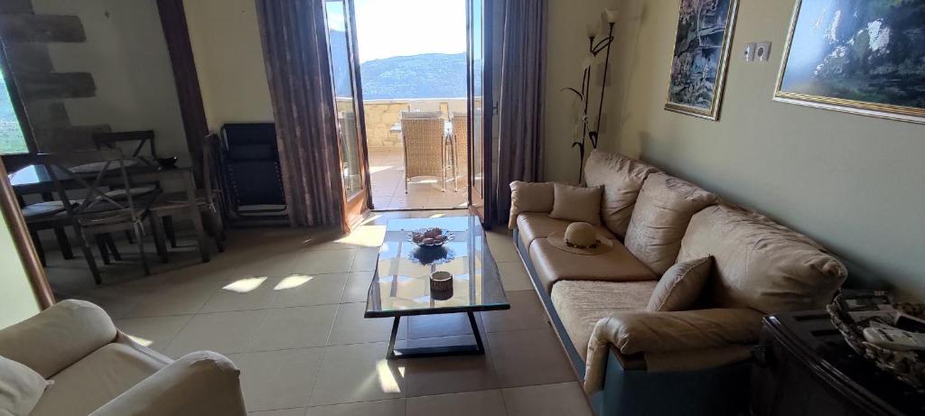 A seating area at Vasiliki's Residence - Breathtaking View