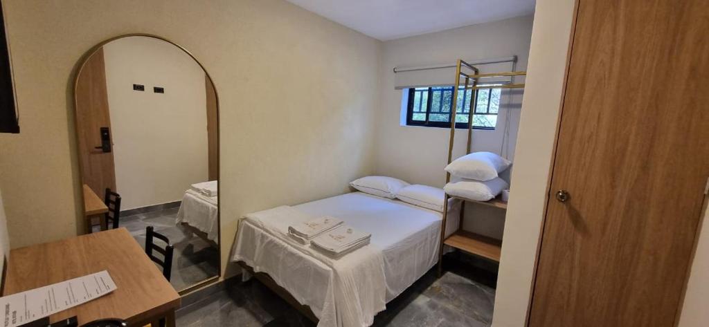 Postel nebo postele na pokoji v ubytování Hotel RUTA365