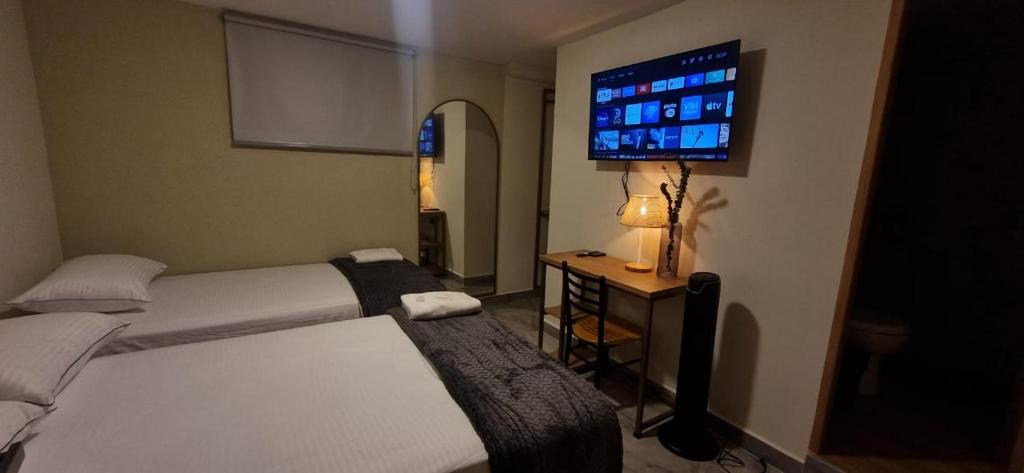 Postel nebo postele na pokoji v ubytování Hotel RUTA365