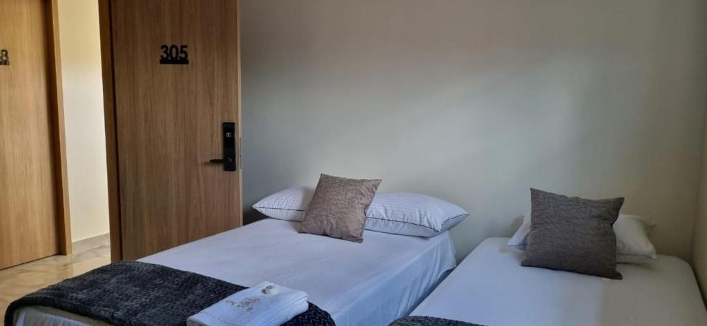 Postel nebo postele na pokoji v ubytování Hotel RUTA365