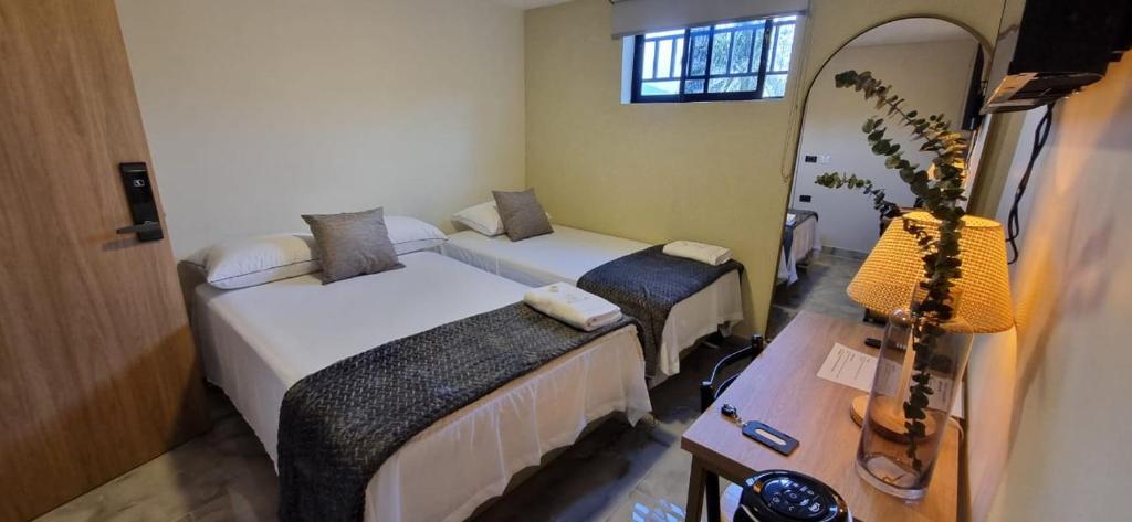 Postel nebo postele na pokoji v ubytování Hotel RUTA365