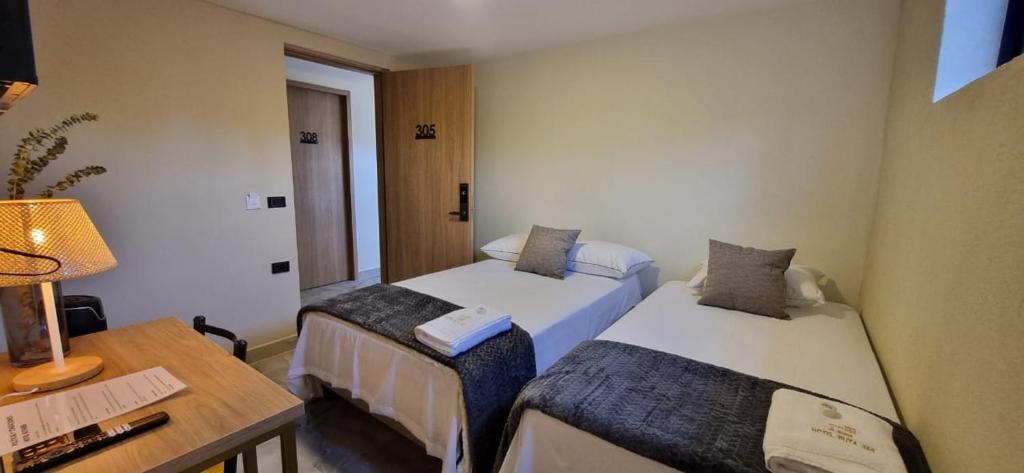 Postel nebo postele na pokoji v ubytování Hotel RUTA365