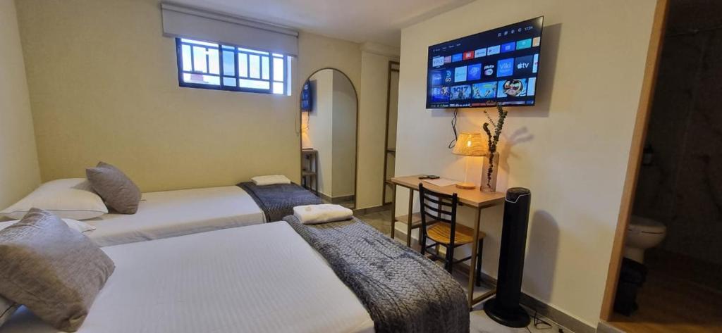 Postel nebo postele na pokoji v ubytování Hotel RUTA365