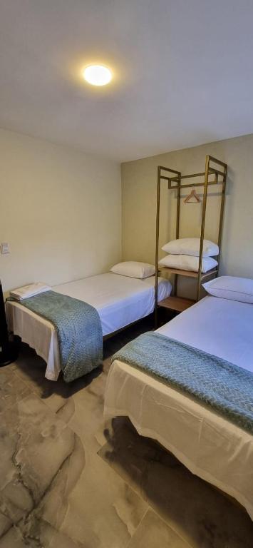 Postel nebo postele na pokoji v ubytování Hotel RUTA365