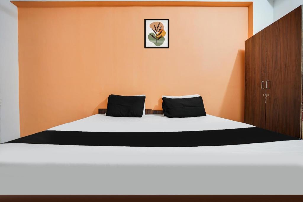Postel nebo postele na pokoji v ubytování Hotel O Harmony