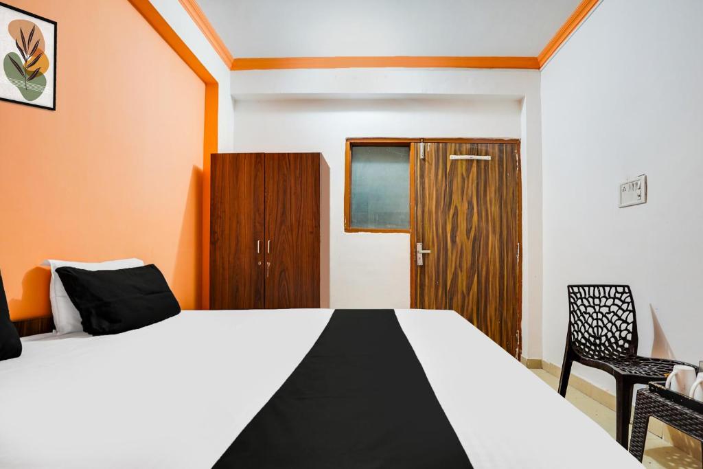 Postel nebo postele na pokoji v ubytování Hotel O Harmony