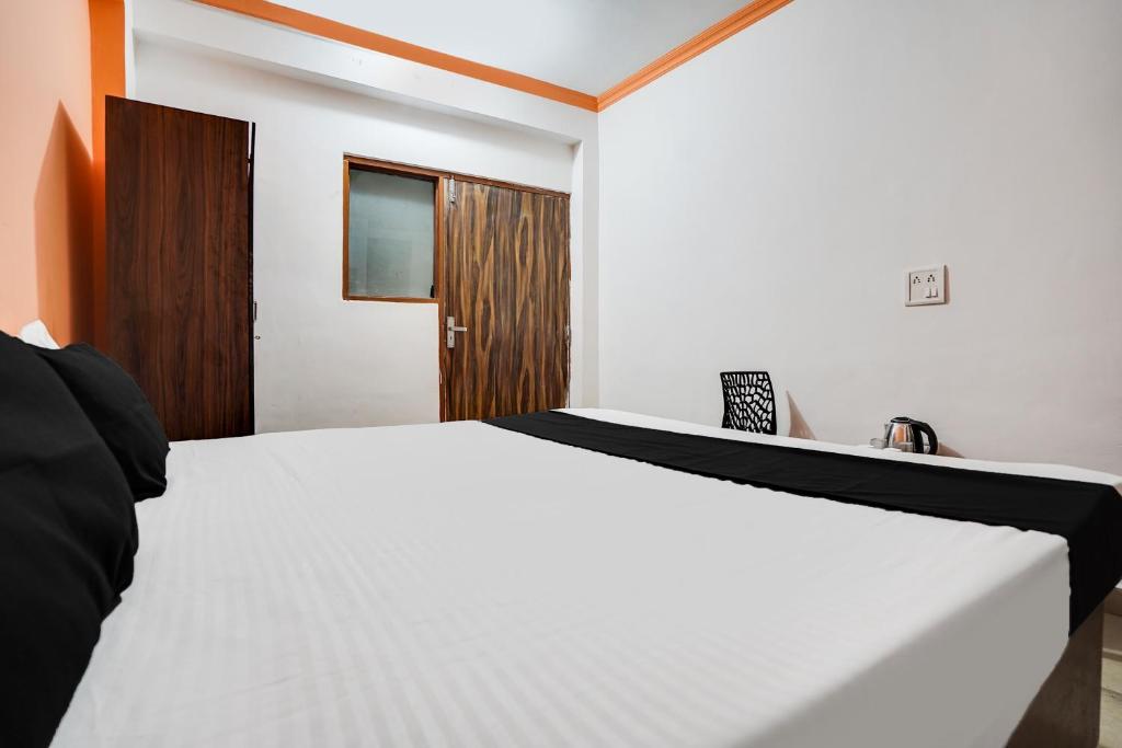 Postel nebo postele na pokoji v ubytování Hotel O Harmony