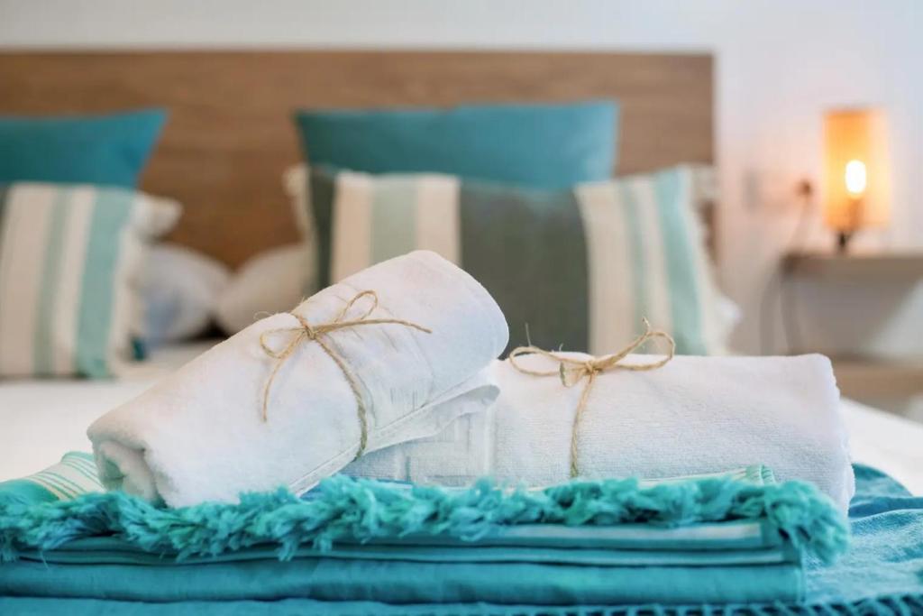 a pair of white socks sitting on top of a bed at Atlantic Soul in Playa Blanca