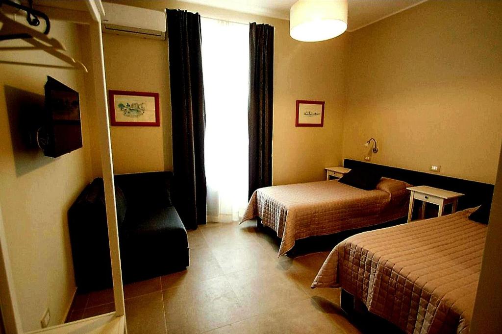 Postel nebo postele na pokoji v ubytování Papiroom's