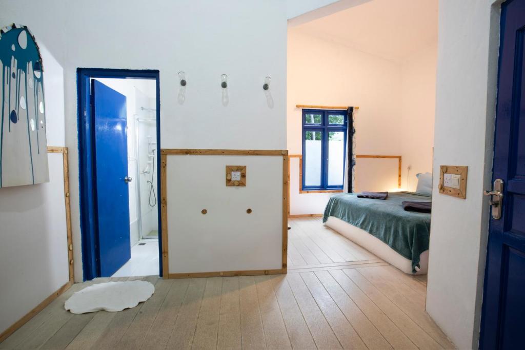Postel nebo postele na pokoji v ubytování La Due Thulusdhoo