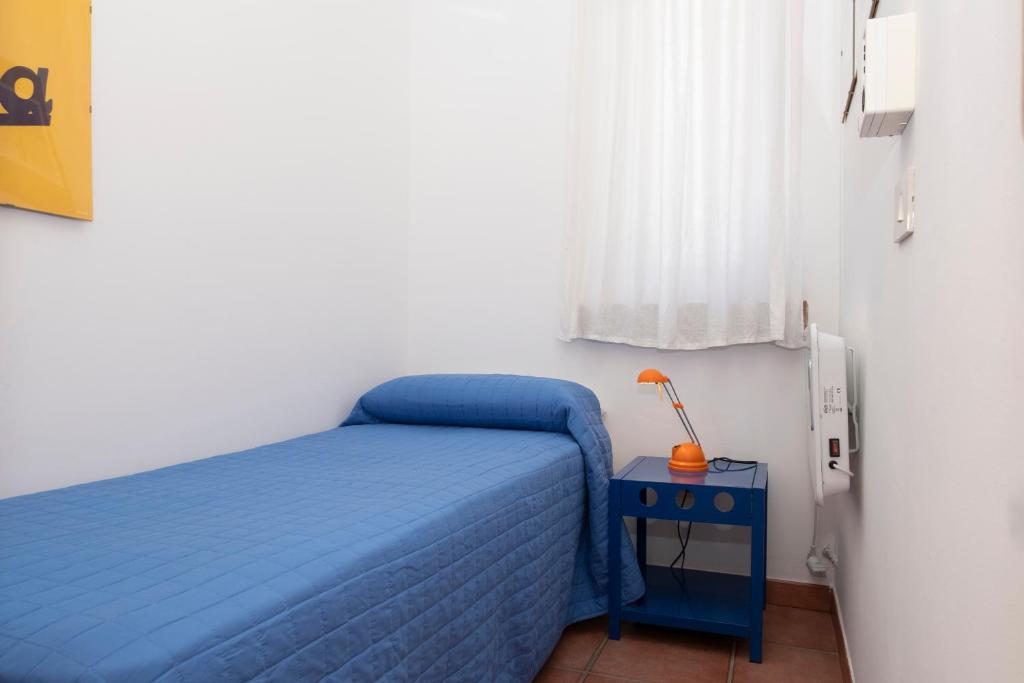 Łóżko lub łóżka w pokoju w obiekcie Casa Ponente con Vista Mare a Macari