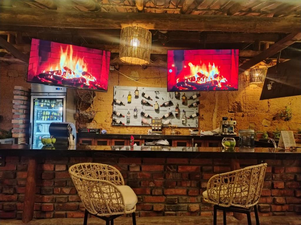 TV a/nebo společenská místnost v ubytování Hotel Hicasua y Centro de Convenciones