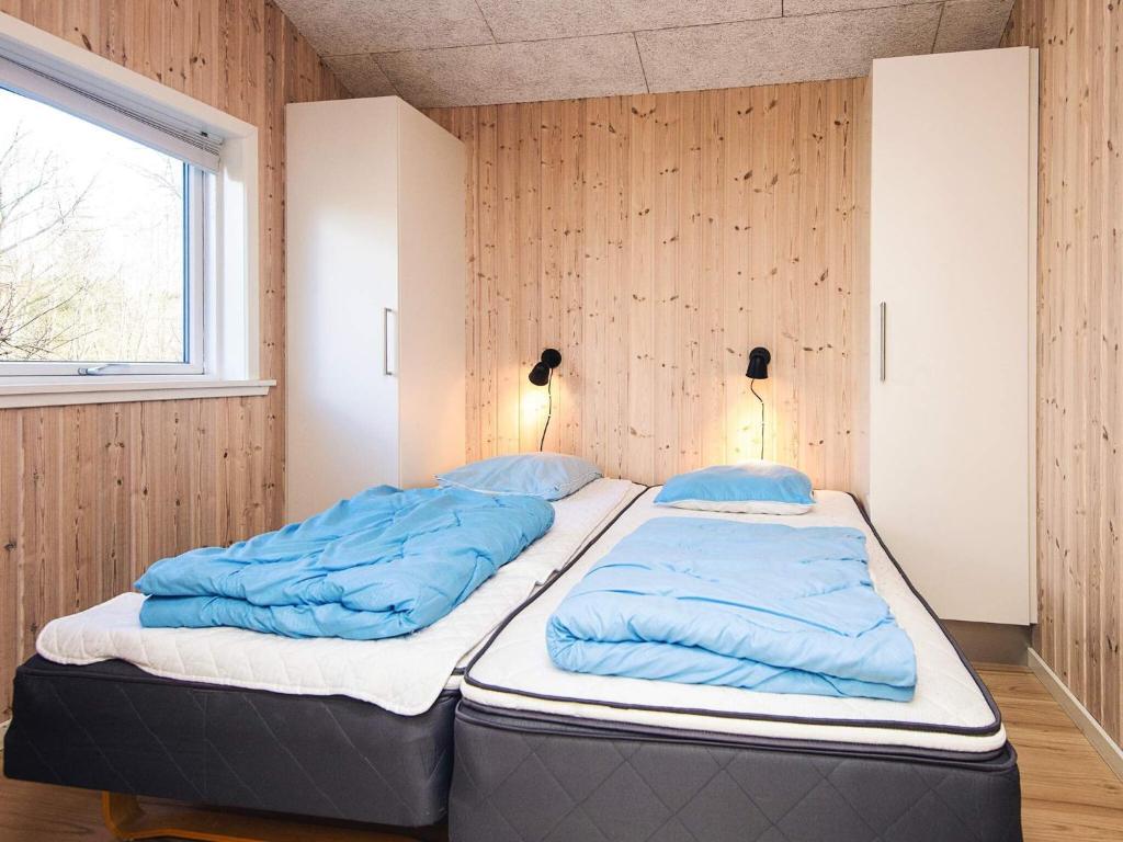 Postel nebo postele na pokoji v ubytování Holiday home Oksbøl LXXXI