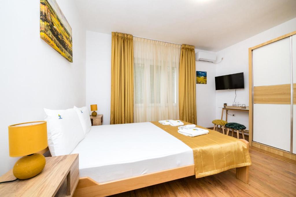 Posteľ alebo postele v izbe v ubytovaní Apartmani F&M
