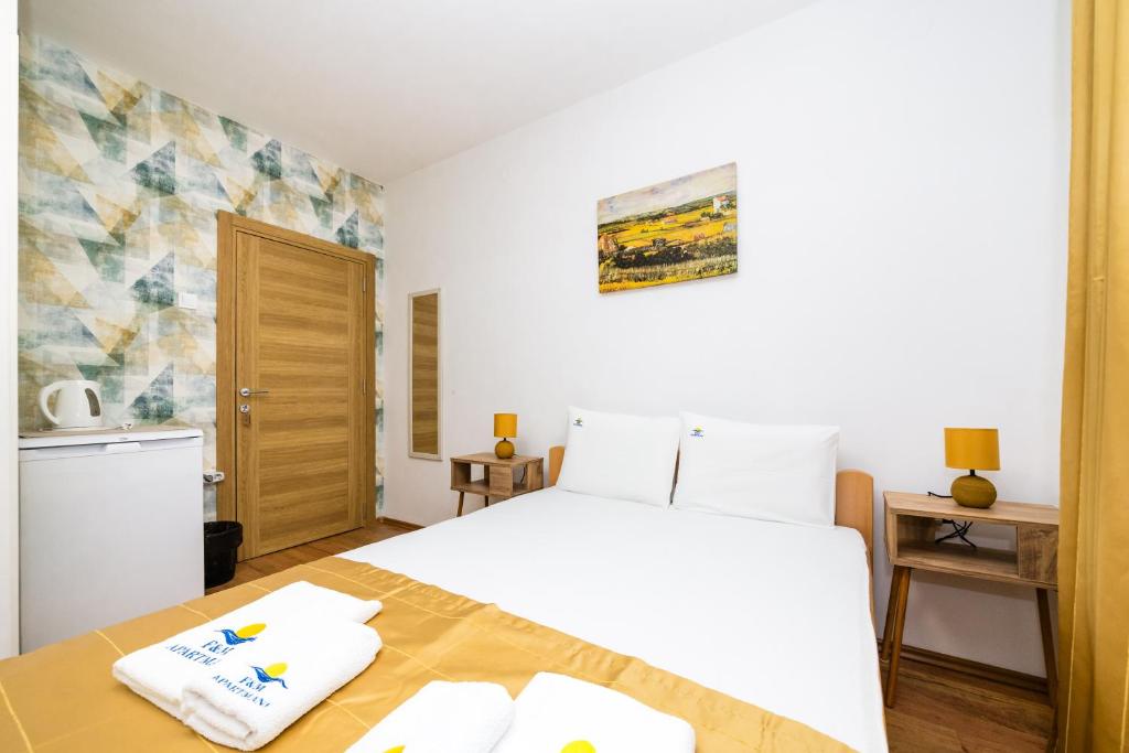 Posteľ alebo postele v izbe v ubytovaní Apartmani F&M