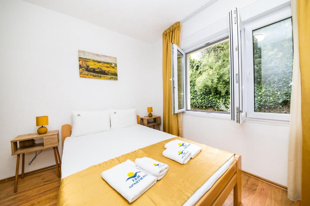 Posteľ alebo postele v izbe v ubytovaní Apartmani F&M