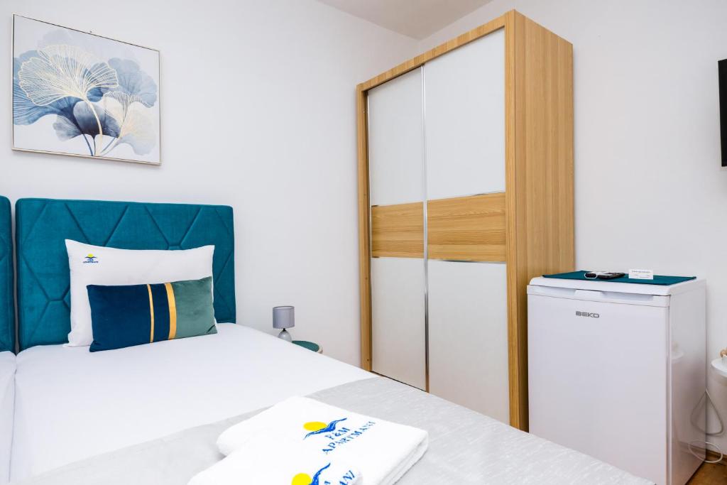 Posteľ alebo postele v izbe v ubytovaní Apartmani F&M