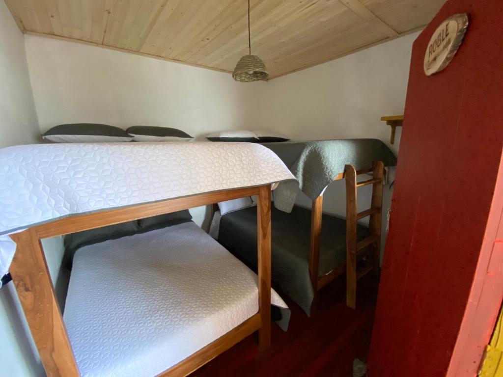 Rúm í herbergi á El Hostal del Abuelo
