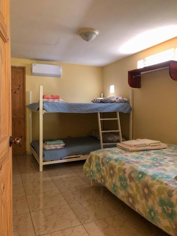 Postel nebo postele na pokoji v ubytování Cabañas El Valle