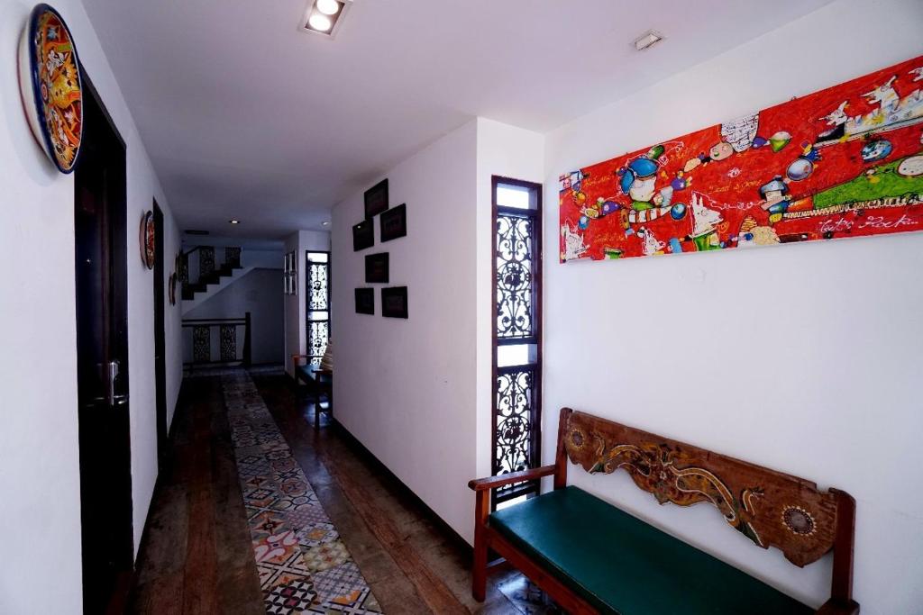 Postel nebo postele na pokoji v ubytování Baan Huenphen Boutique Hotel