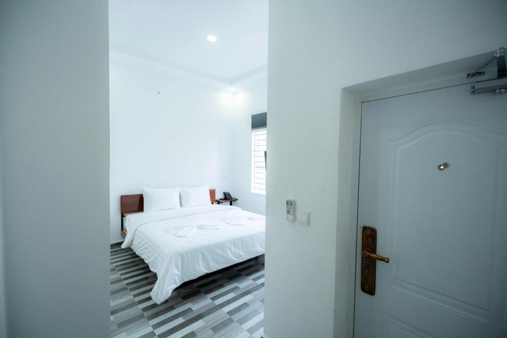 Postel nebo postele na pokoji v ubytování Bona Hotel
