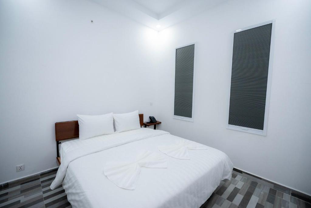 Postel nebo postele na pokoji v ubytování Bona Hotel
