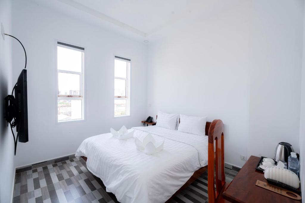 Postel nebo postele na pokoji v ubytování Bona Hotel