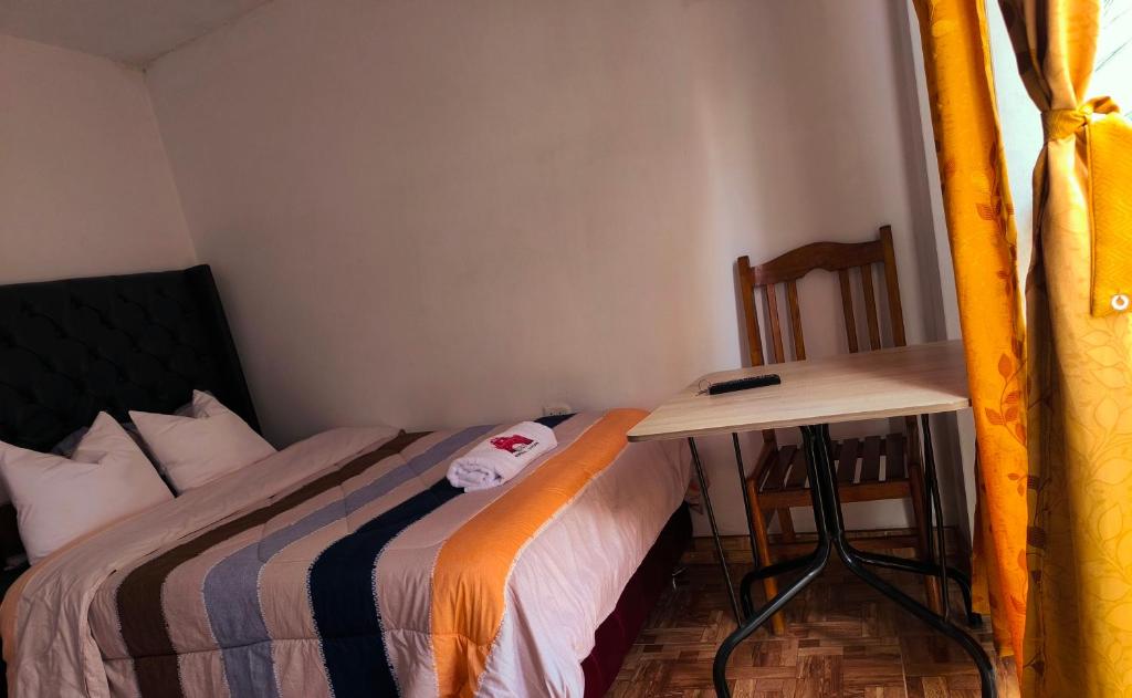 Postel nebo postele na pokoji v ubytování Hospedaje Aqquazul Ayacucho